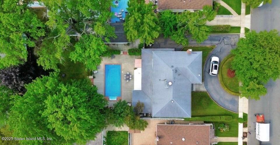 160 Rathbun Avenue Staten Island, NY 10312 - Photo 3 of 37 an aerial view of a house with a yard and trees all around