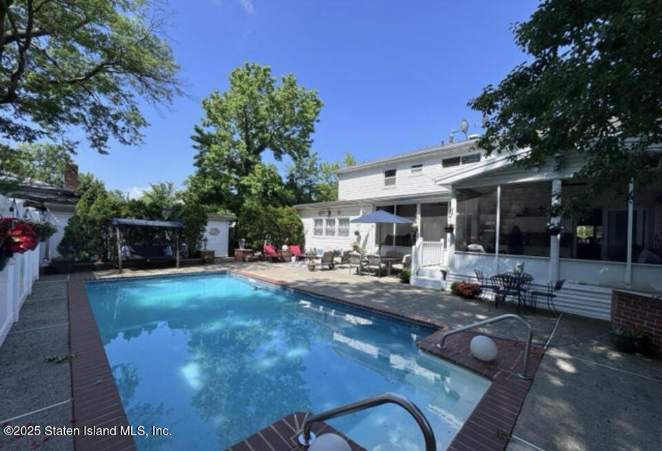 160 Rathbun Avenue Staten Island, NY 10312 - Photo 31 of 37 a view of a house with backyard sitting area and garden