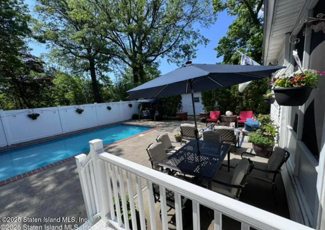 a view of a chairs and tables in the patio