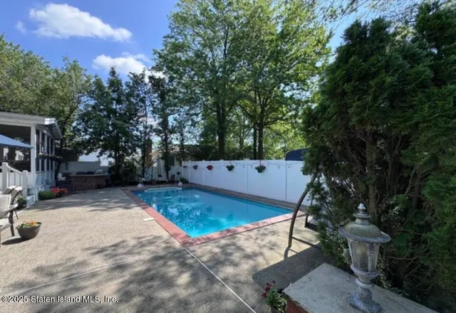 a view of a backyard with a tree