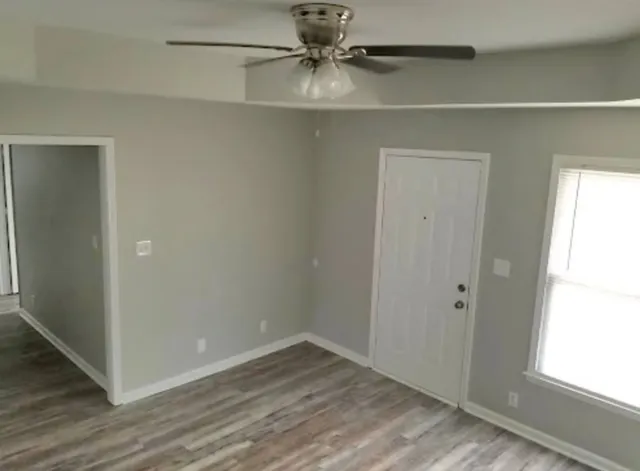 a view of an empty room with a window