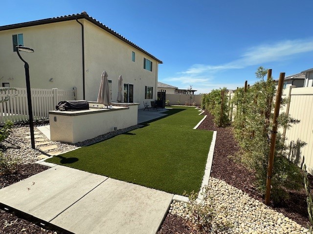 34294 Coconut Circle Winchester, CA 92596 - Photo 12 of 17 a view of a backyard with sitting area