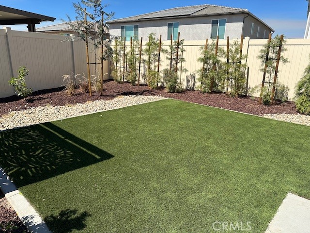 34294 Coconut Circle Winchester, CA 92596 - Photo 13 of 17 a front view of a house with garden