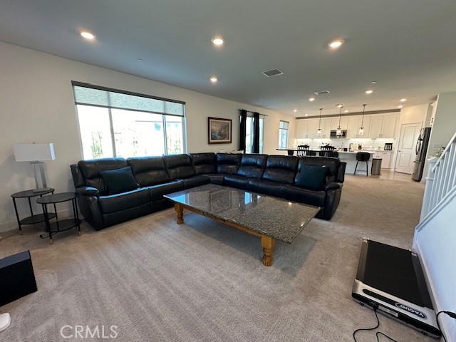 34294 Coconut Circle Winchester, CA 92596 - Photo 7 of 17 a living room with furniture and a flat screen tv