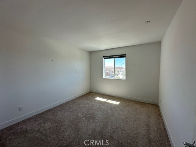 34294 Coconut Circle Winchester, CA 92596 - Photo 9 of 17 an empty room with windows