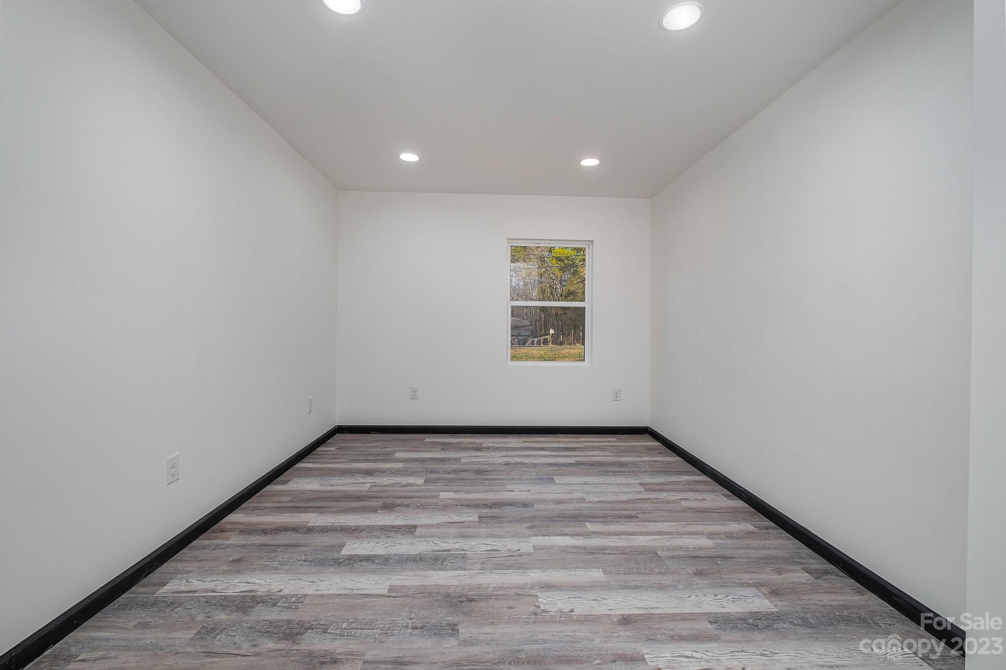 6922 Pear Tree Road Charlotte, NC 28216 - Photo 15 of 26 an empty room with windows