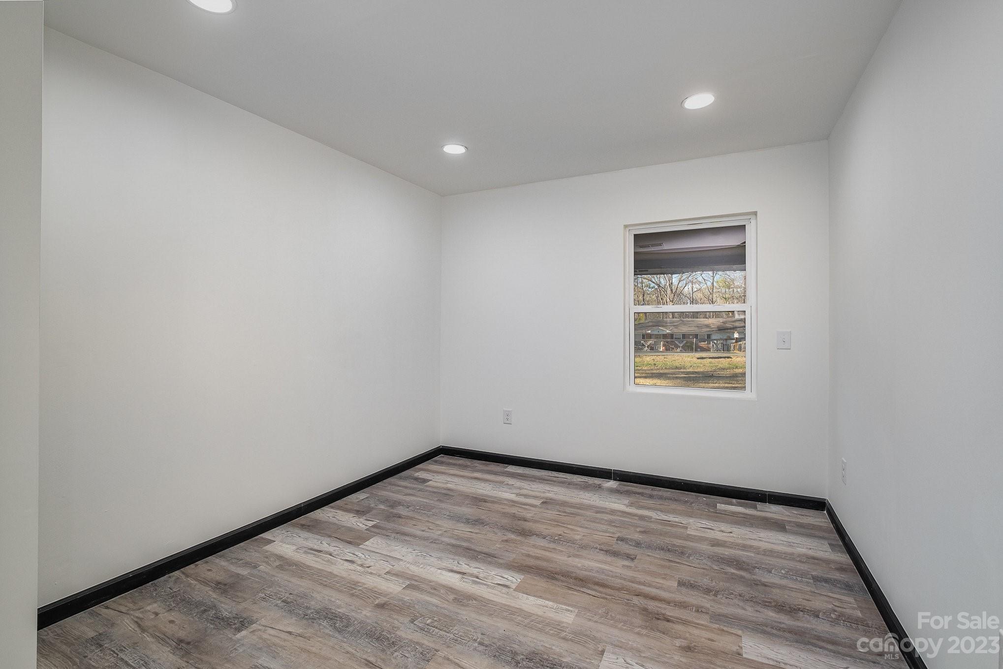 6922 Pear Tree Road Charlotte, NC 28216 - Photo 19 of 26 a view of empty room with wooden floor