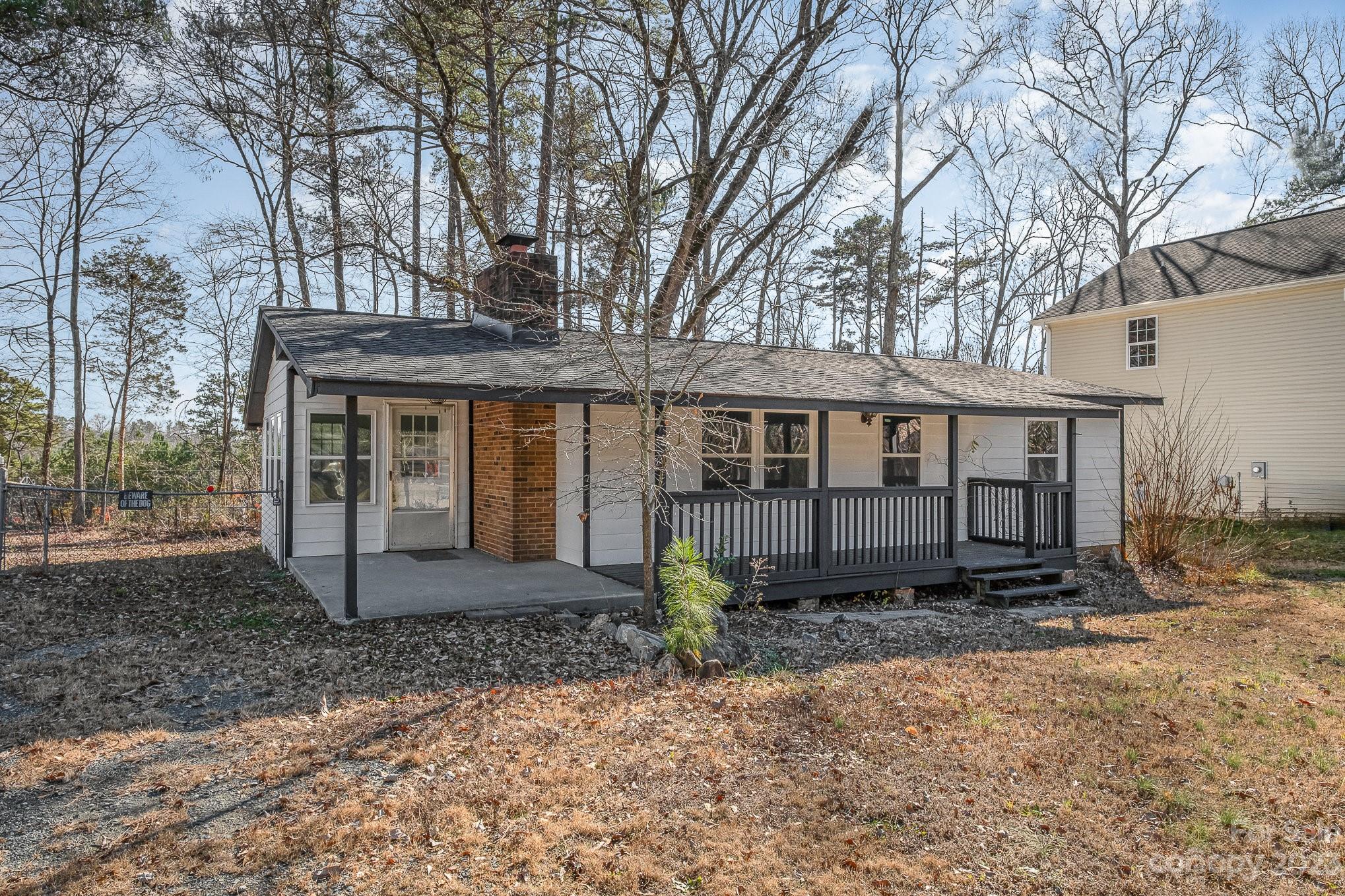 6922 Pear Tree Road Charlotte, NC 28216 - Photo 2 of 26 a front view of a house with a yard