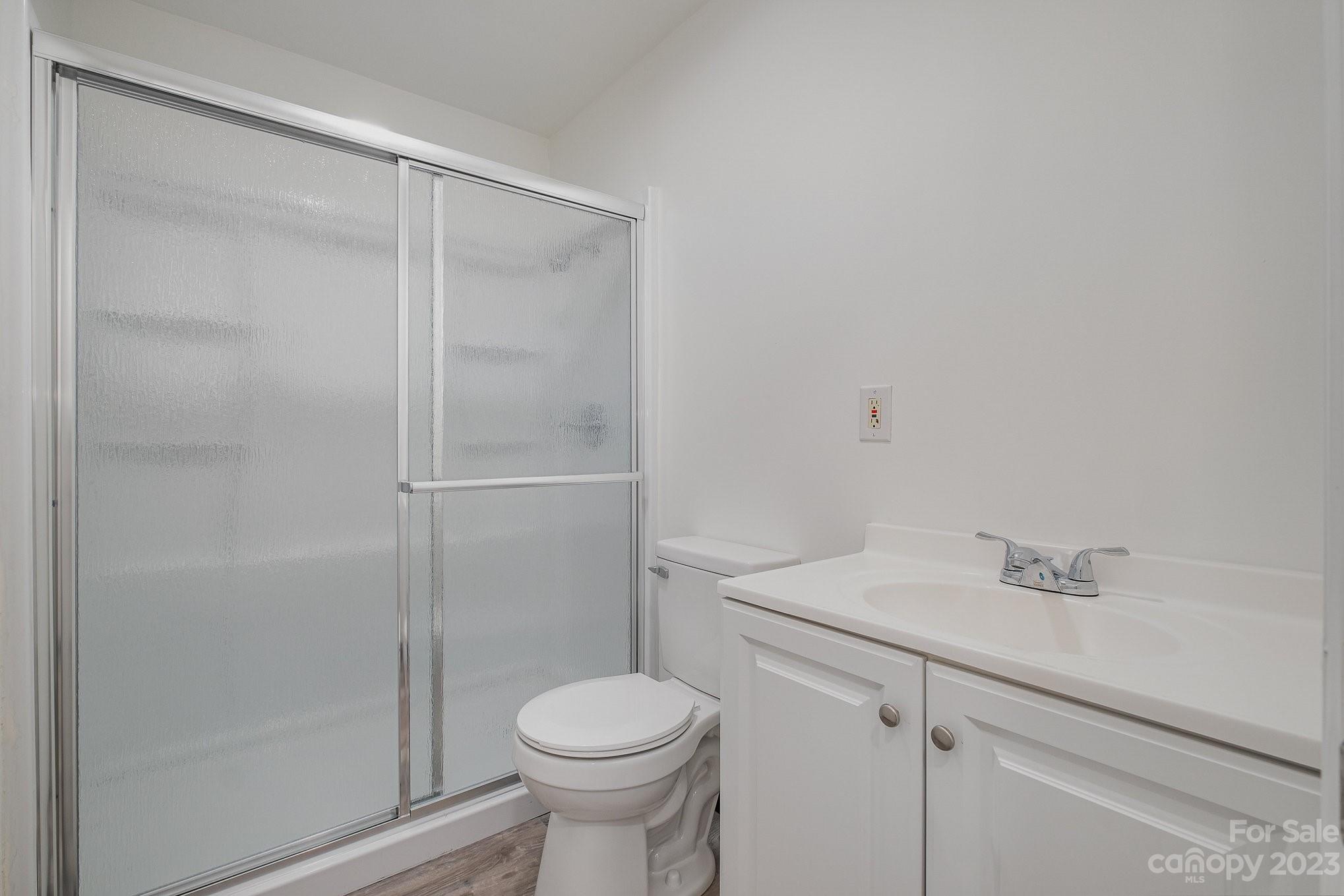 6922 Pear Tree Road Charlotte, NC 28216 - Photo 21 of 26 a bathroom with a shower and a toilet
