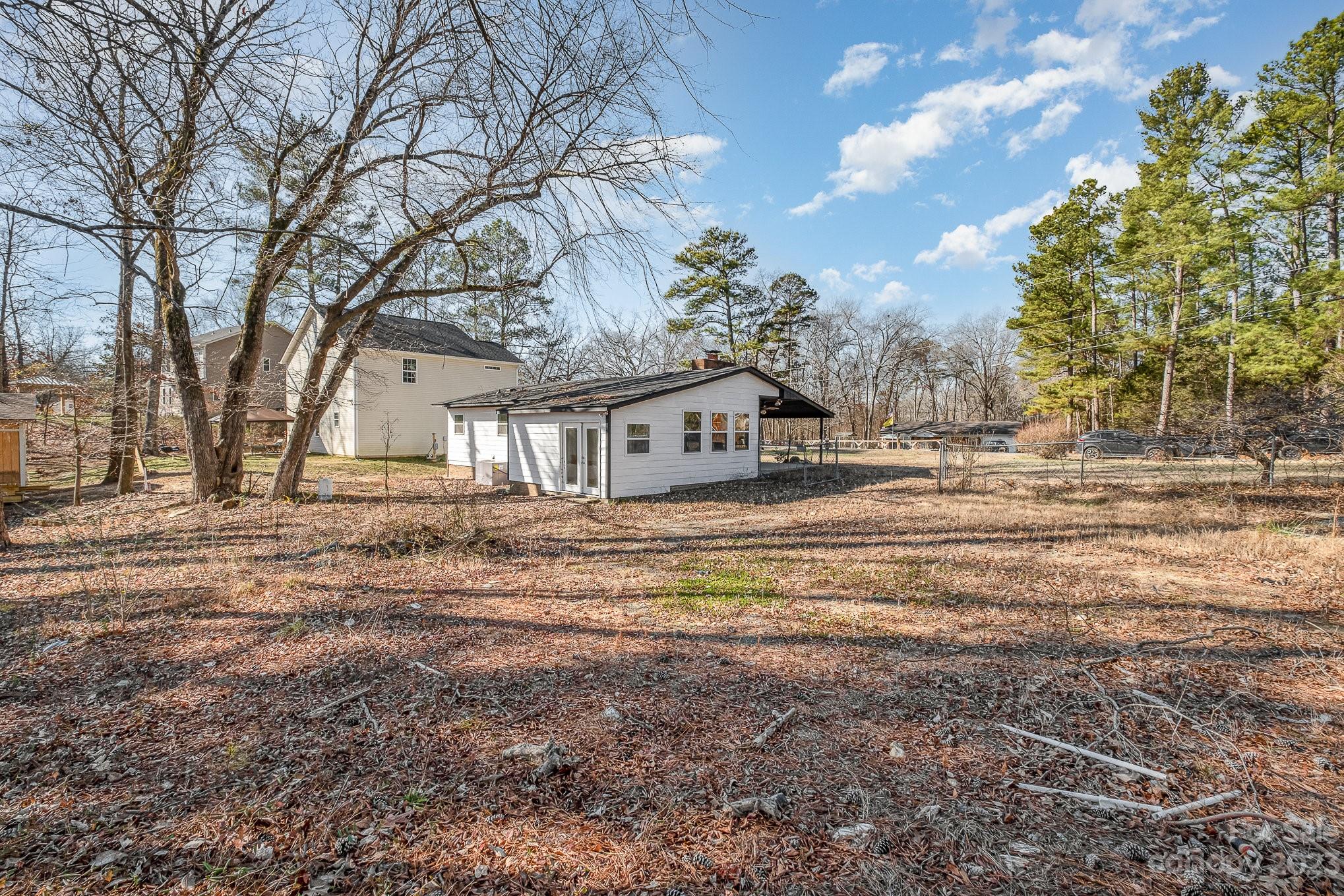 6922 Pear Tree Road Charlotte, NC 28216 - Photo 25 of 26 a view of a house with a yard