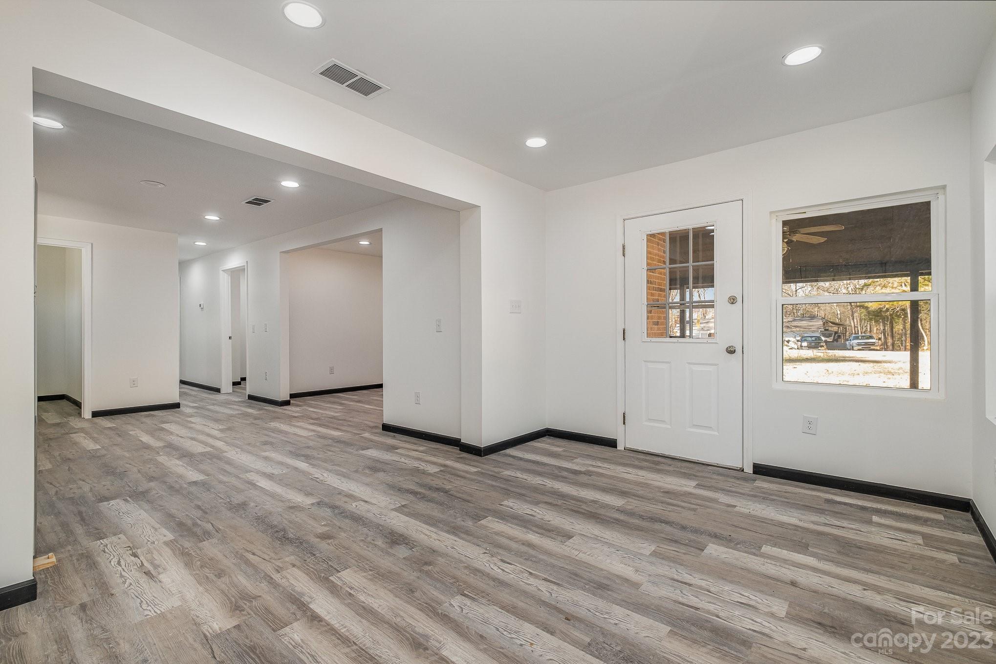 6922 Pear Tree Road Charlotte, NC 28216 - Photo 5 of 26 a view of an empty room with a window