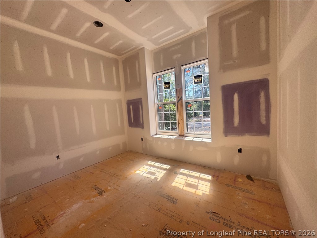 45 Beckett Ridge Pinehurst, NC 28374 - Photo 7 of 50 a view of empty room with windows