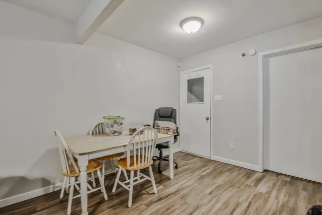 a workspace with furniture and wooden floor