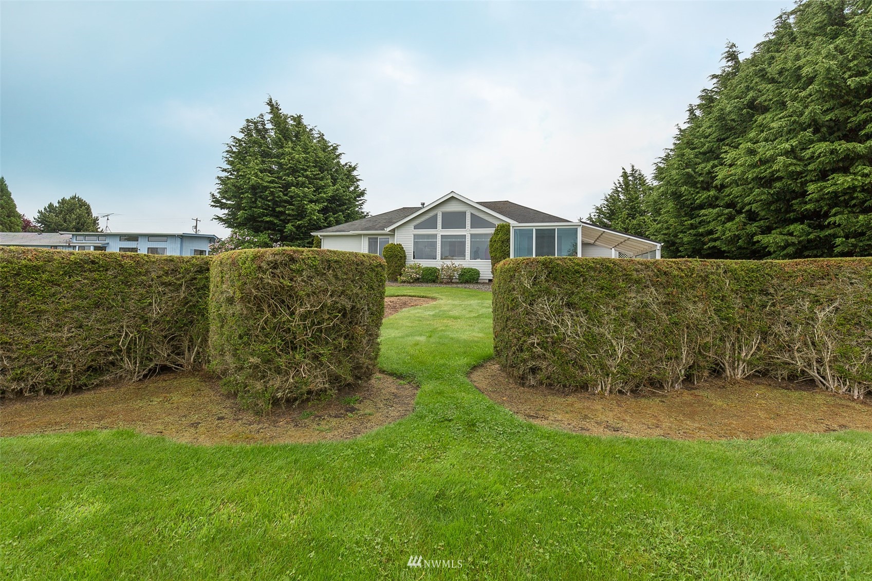 601 East Anderson Road Sequim, WA 98382 - Photo 12 of 37 a view of a house with a yard