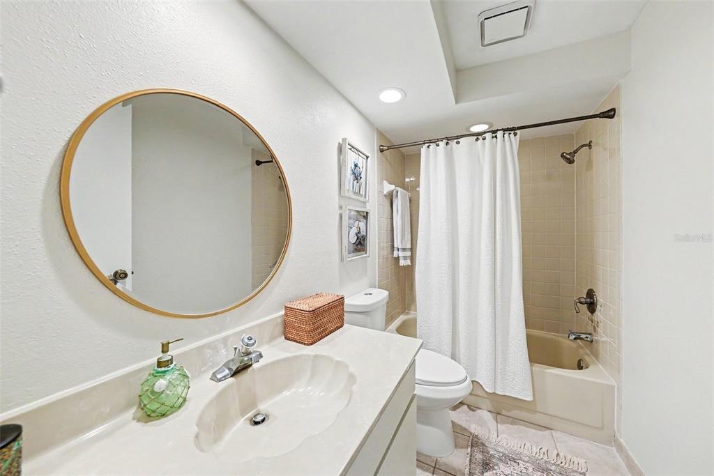9204 Golf View Drive New Port Richey, FL 34655 - Photo 26 of 33 a bathroom with a sink a toilet and shower