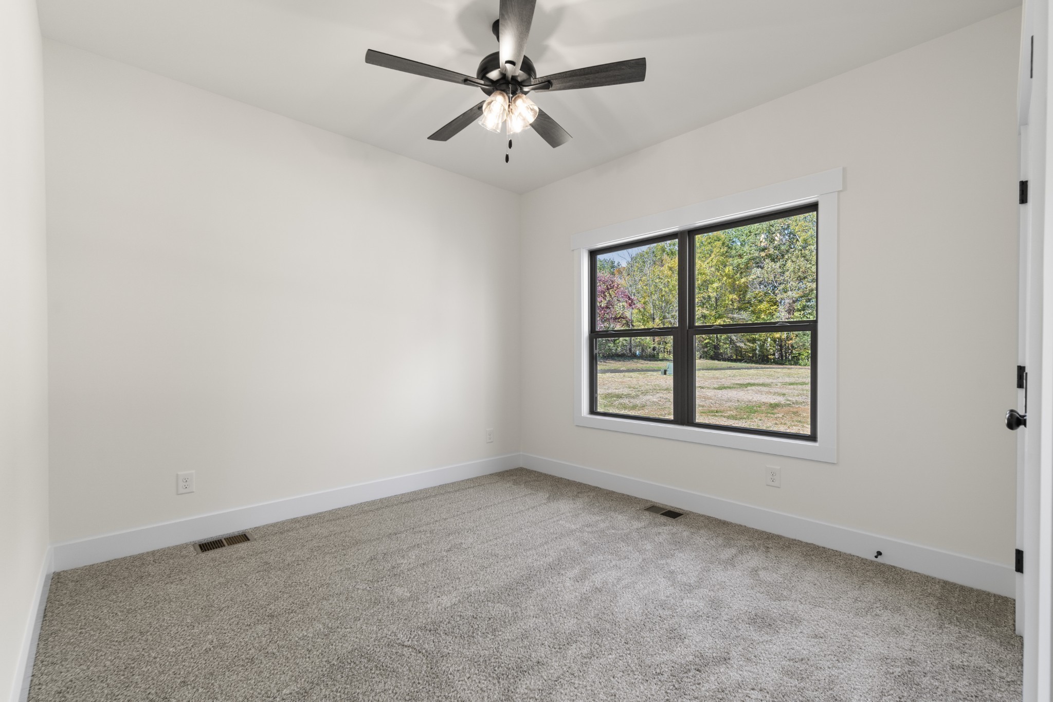 2969 Lights Chapel Road Greenbrier, TN 37073 - Photo 20 of 34 an empty room with a window and a fan