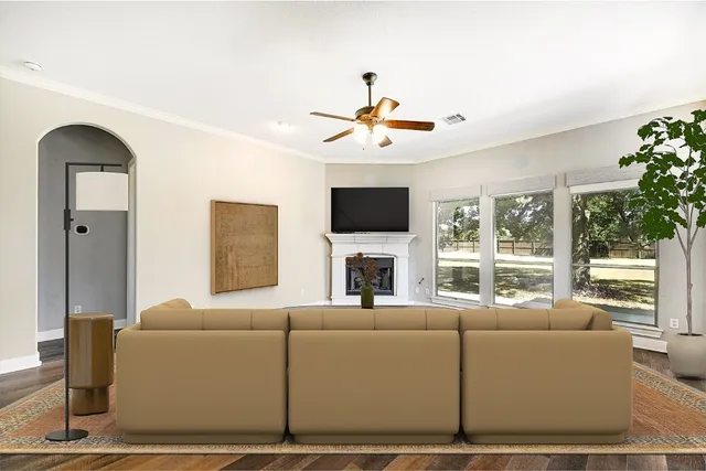 a living room with furniture and a flat screen tv