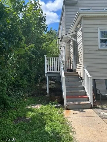 a kitchen with granite countertop a sink stove and cabinets