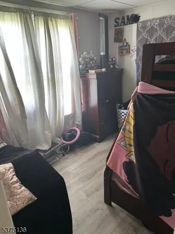 a white toilet sitting next to a bath tub and a shower