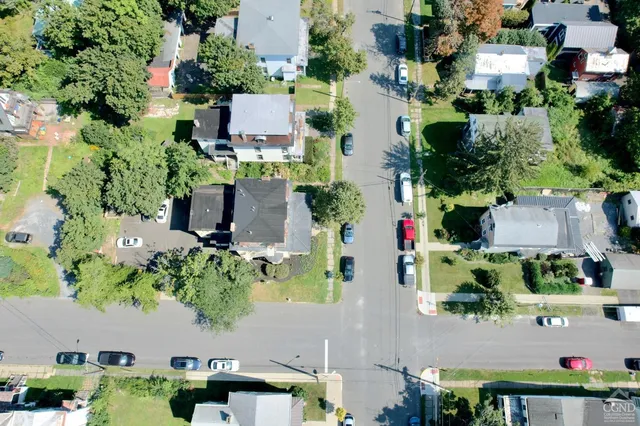 an aerial view of residential houses with outdoor space