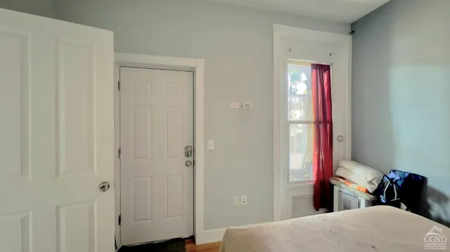 a bedroom with a bed and a closet