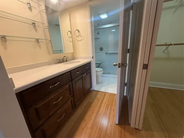 an aerial view of a house with a garden and lake view