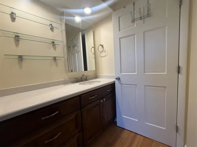 an aerial view of residential houses with outdoor space and river