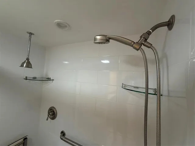 an aerial view of a city with a lake view