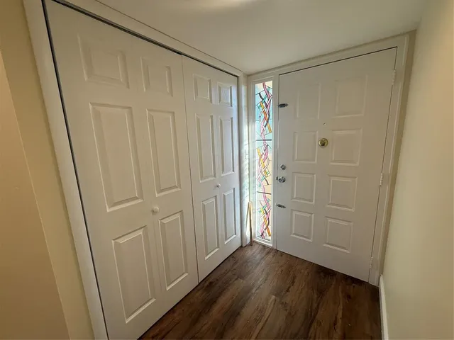 a kitchen with granite countertop stainless steel appliances and wooden cabinets