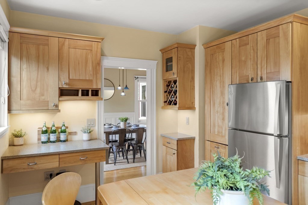 46 Gardner Road, Unit 2 Brookline, MA 02445 - Photo 13 of 38 a kitchen with stainless steel appliances a refrigerator and a dining table