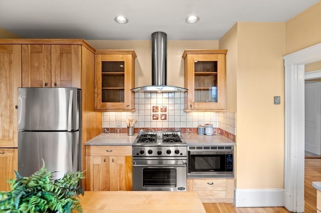 46 Gardner Road, Unit 2 Brookline, MA 02445 - Photo 14 of 38 a kitchen with stainless steel appliances granite countertop a stove a refrigerator and a stove