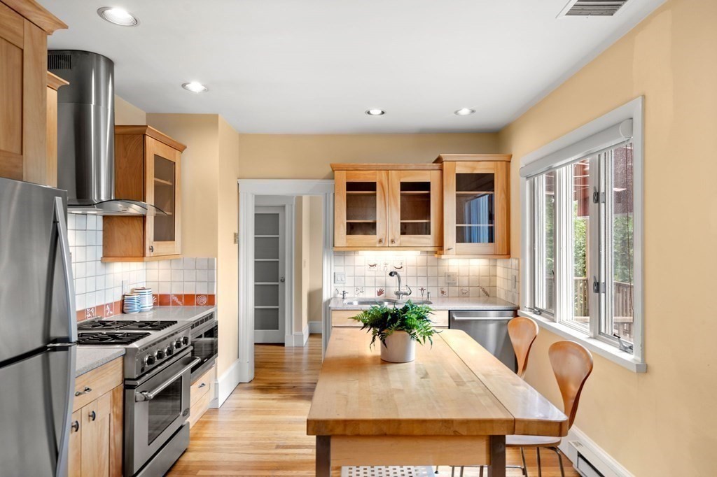 46 Gardner Road, Unit 2 Brookline, MA 02445 - Photo 16 of 38 a kitchen with stainless steel appliances granite countertop a stove and a refrigerator