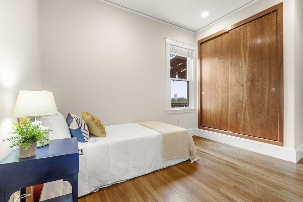 46 Gardner Road, Unit 2 Brookline, MA 02445 - Photo 21 of 38 a bedroom with a bed and a window