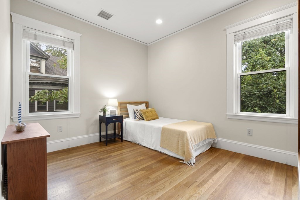 46 Gardner Road, Unit 2 Brookline, MA 02445 - Photo 22 of 38 a bedroom with a bed and window