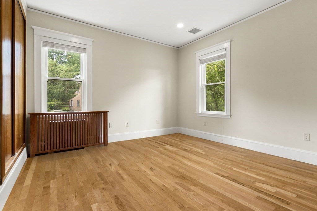 46 Gardner Road, Unit 2 Brookline, MA 02445 - Photo 24 of 38 a view of a room with wooden floor and a window