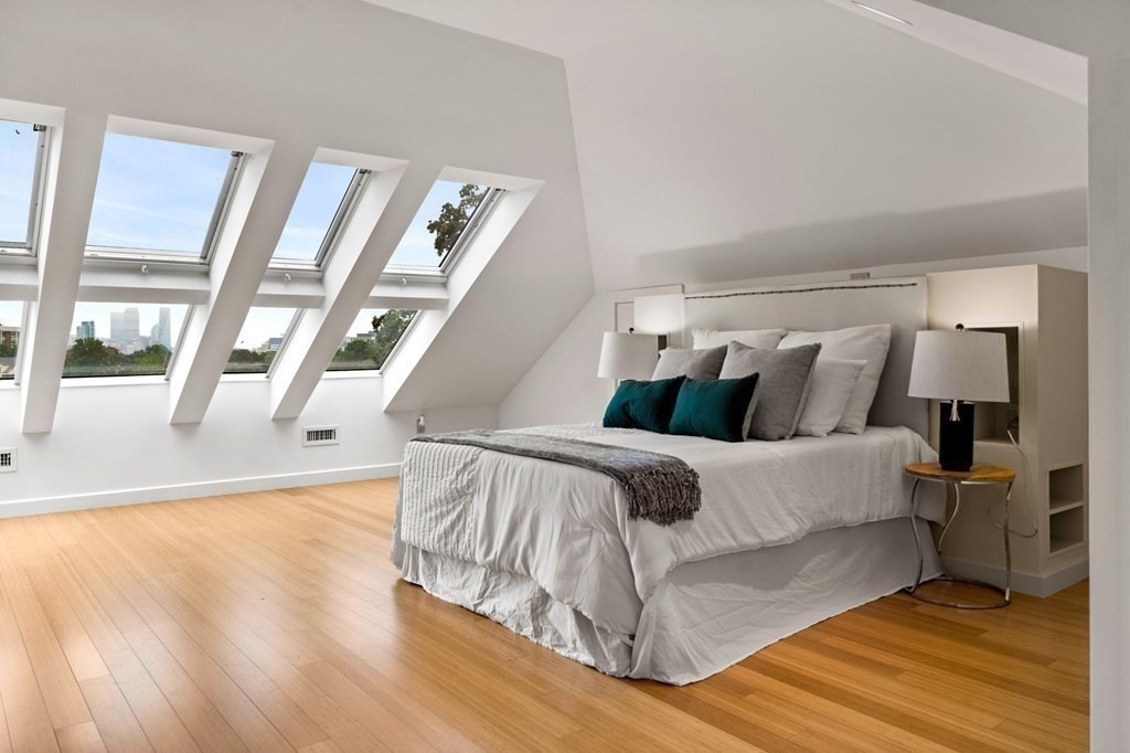 46 Gardner Road, Unit 2 Brookline, MA 02445 - Photo 27 of 38 a bed sitting in a bedroom next to a window