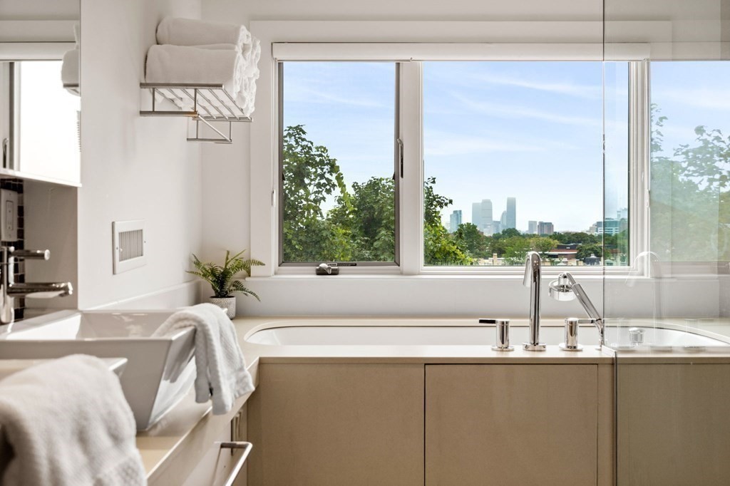 46 Gardner Road, Unit 2 Brookline, MA 02445 - Photo 35 of 38 a living room filled with furniture and a large window