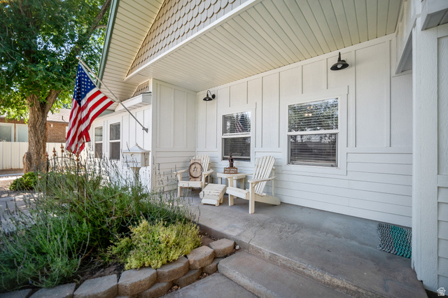 236 West 300 South Hurricane, UT 84737 - Photo 4 of 76 Inviting front porch featuring white board and batten siding, horizontal siding, and decorative shingle accents