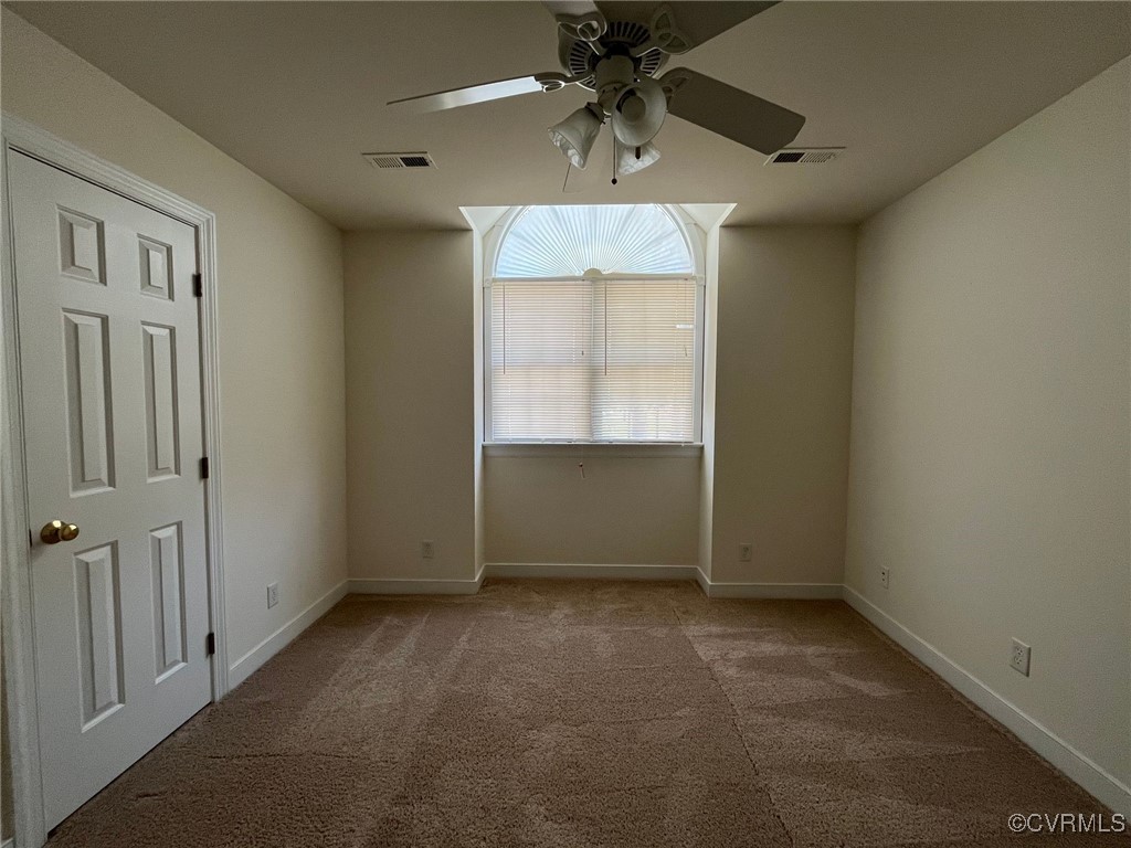 11904 Markey Circle Midlothian, VA 23112 - Photo 19 of 24 an empty room with windows and fan