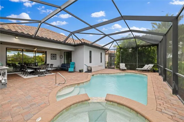 a view of a swimming pool with a patio