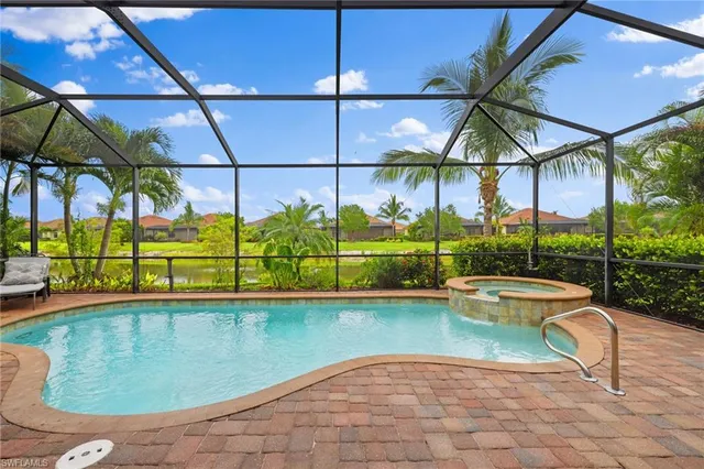 a view of a swimming pool with a patio