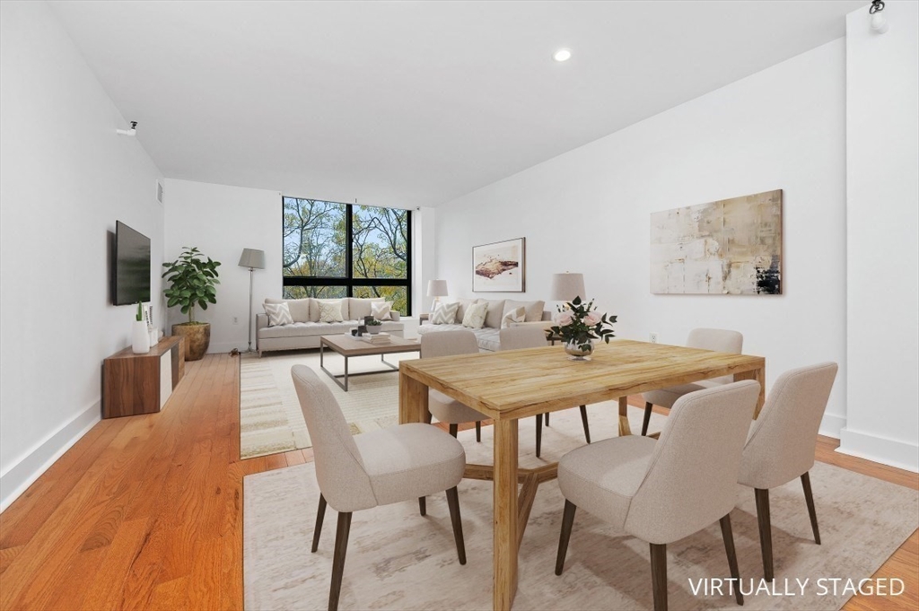 42 8th Street, Unit 1315 Boston, MA 02129 - Photo 1 of 20 a view of a dining room with furniture and wooden floor