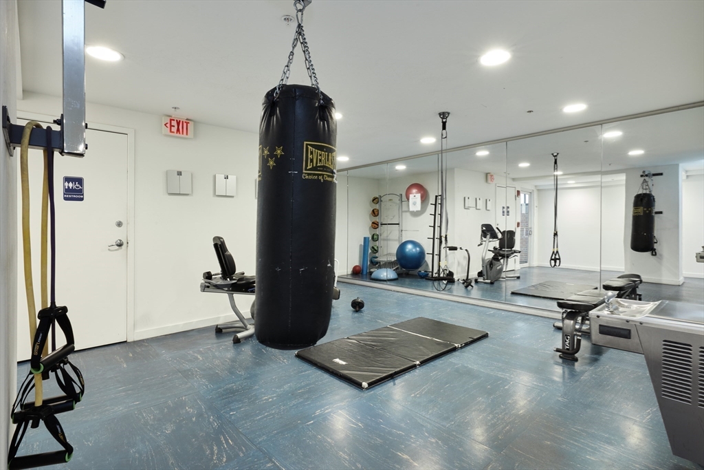 42 8th Street, Unit 1315 Boston, MA 02129 - Photo 13 of 20 a room with gym equipment and a view of living room
