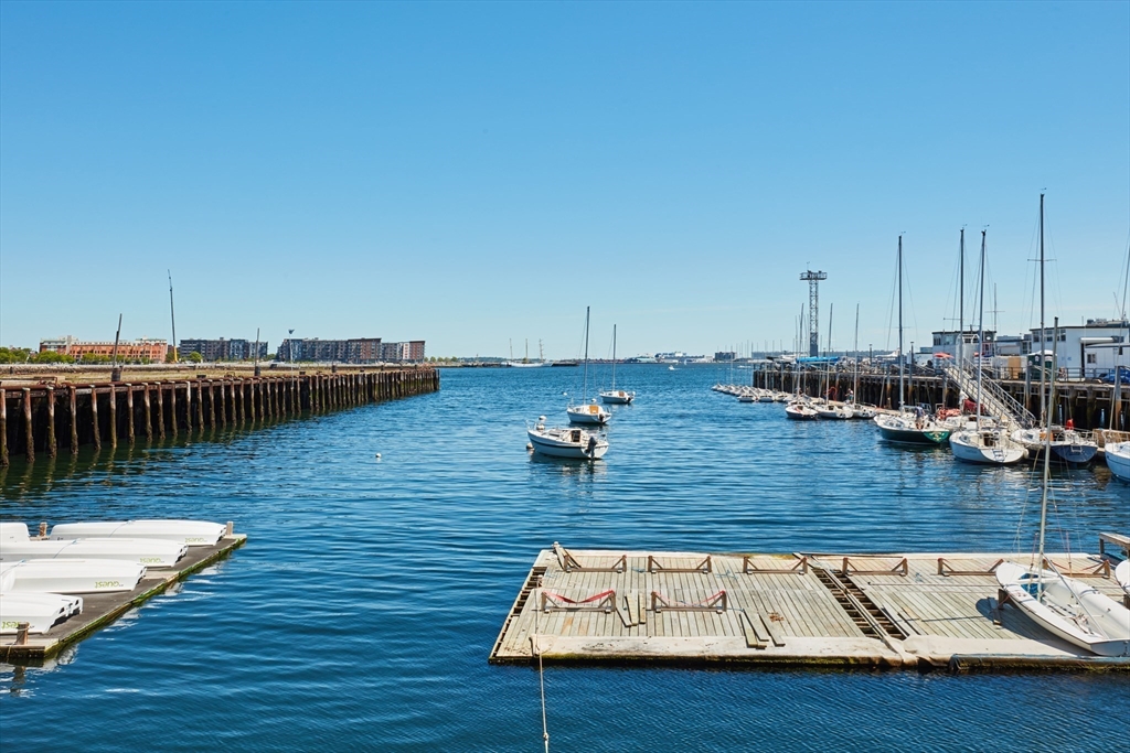 42 8th Street, Unit 1315 Boston, MA 02129 - Photo 20 of 20 a view of a lake with boats and trees in the background