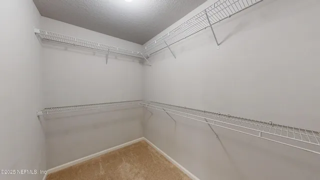 a view of a room with racks on the wall