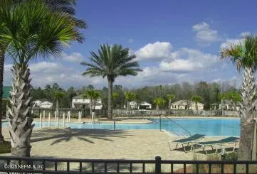 a view of a swimming pool with a patio