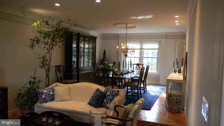 15029 Butterchurn Lane Silver Spring, MD 20905 - Photo 28 of 30 DINING ROOM OPEN TO STEP-DOWN LIVING ROOM