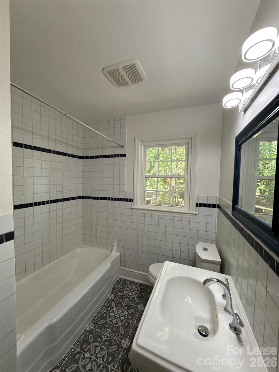 3927 Sharon View Road Charlotte, NC 28226 - Photo 14 of 14 a bathroom with a sink mirror and a bathtub