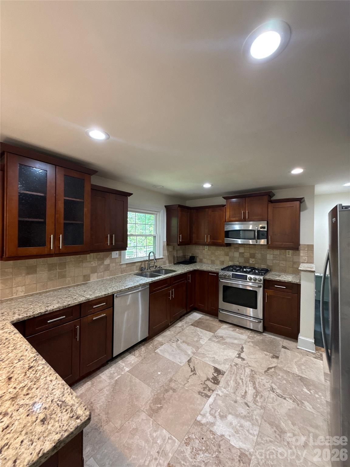 3927 Sharon View Road Charlotte, NC 28226 - Photo 6 of 14 a large kitchen with stainless steel appliances