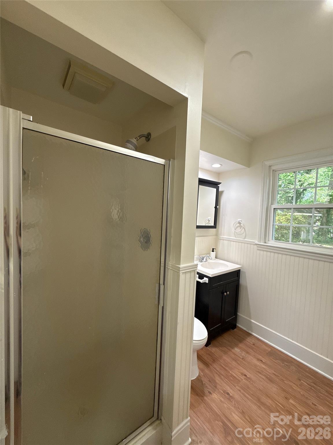 3927 Sharon View Road Charlotte, NC 28226 - Photo 9 of 14 a bathroom with a sink and mirror with shower